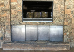 Sliding plate steel fireplace doors